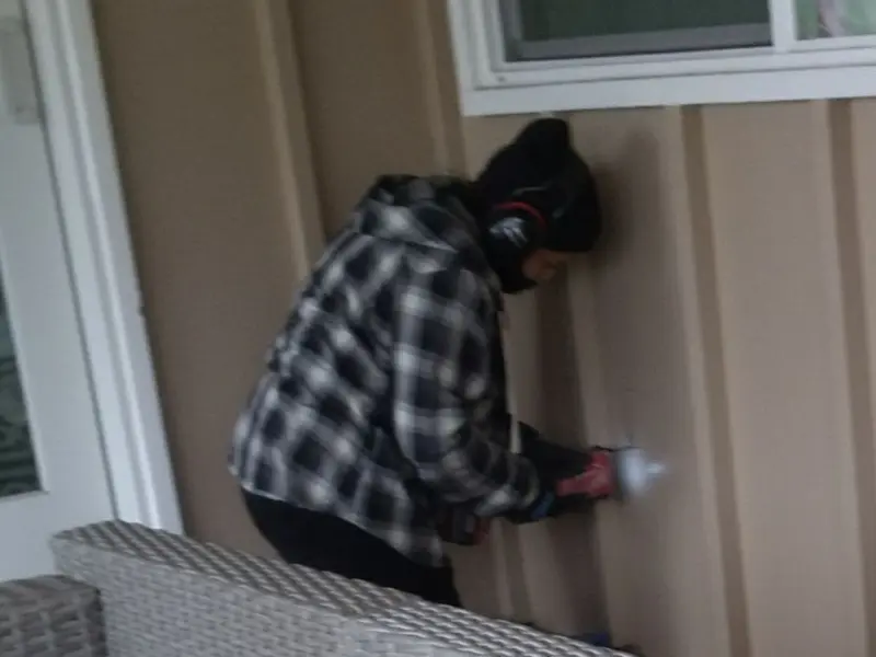 Professional electrician installing an exterior outlet in Nottingham